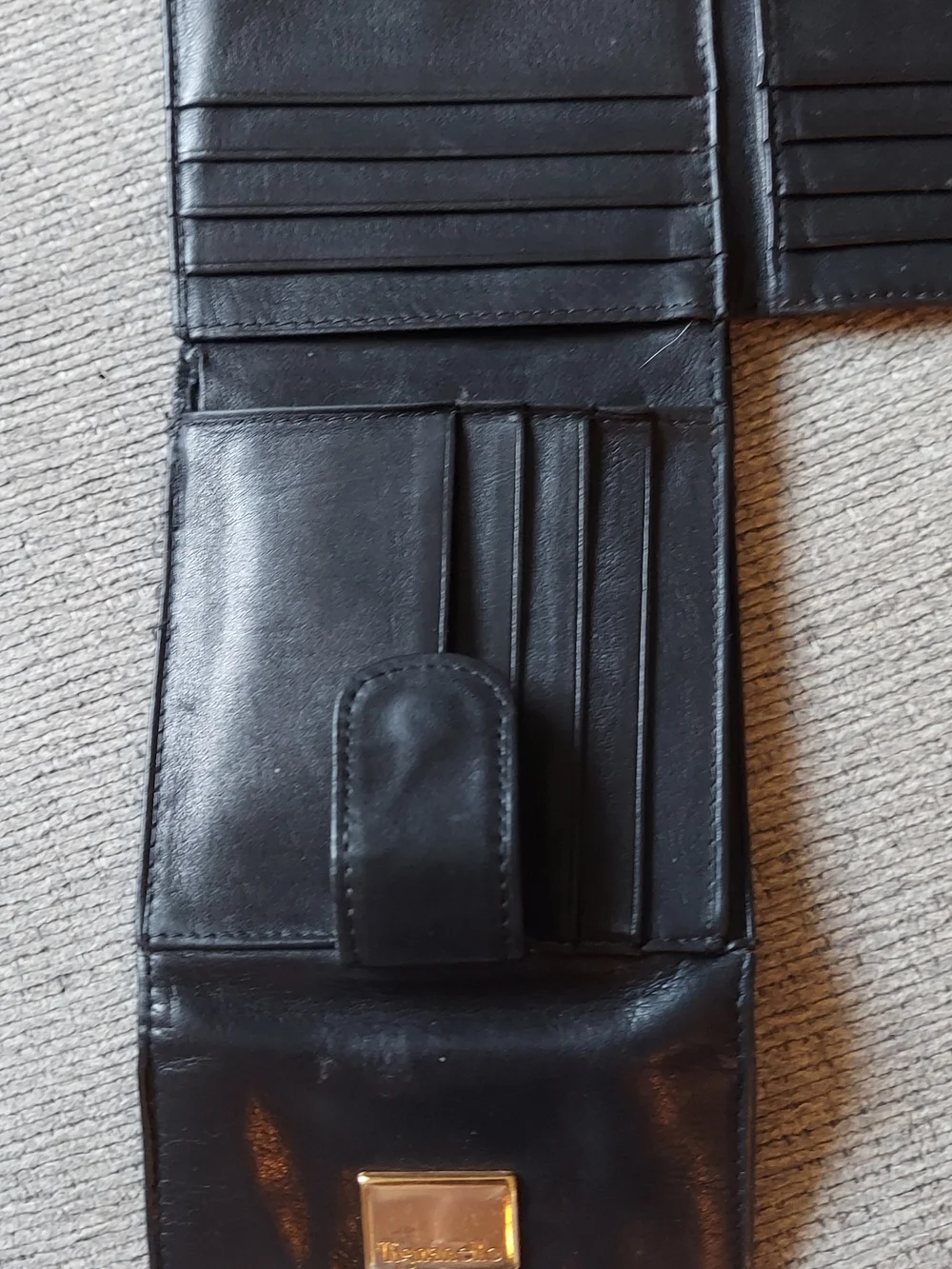 Tignanello Black Leather Bi-Fold Wallet with Gold Plaque